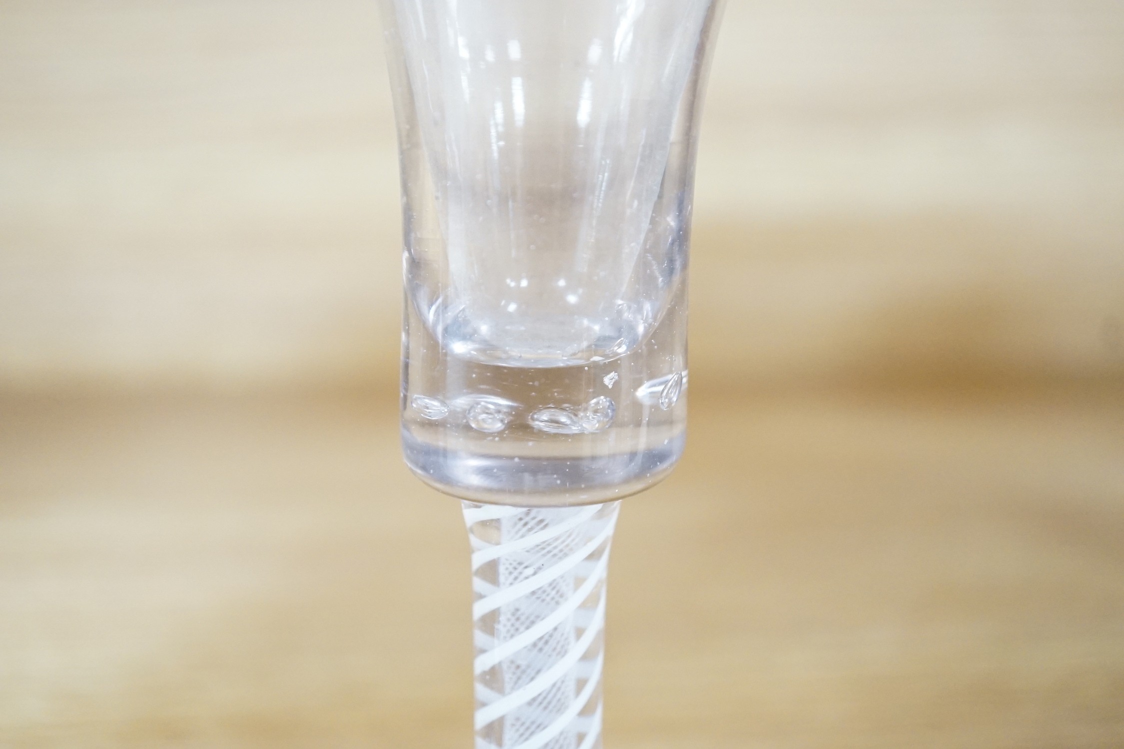 A trio of George III style cotton twist stemmed glasses, 17.5cms high
